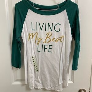 Living my best life graphic tee with green sleeves. New condition. Size medium.